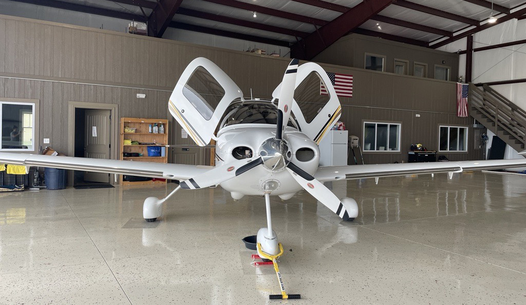 airplane inside of a t hangar